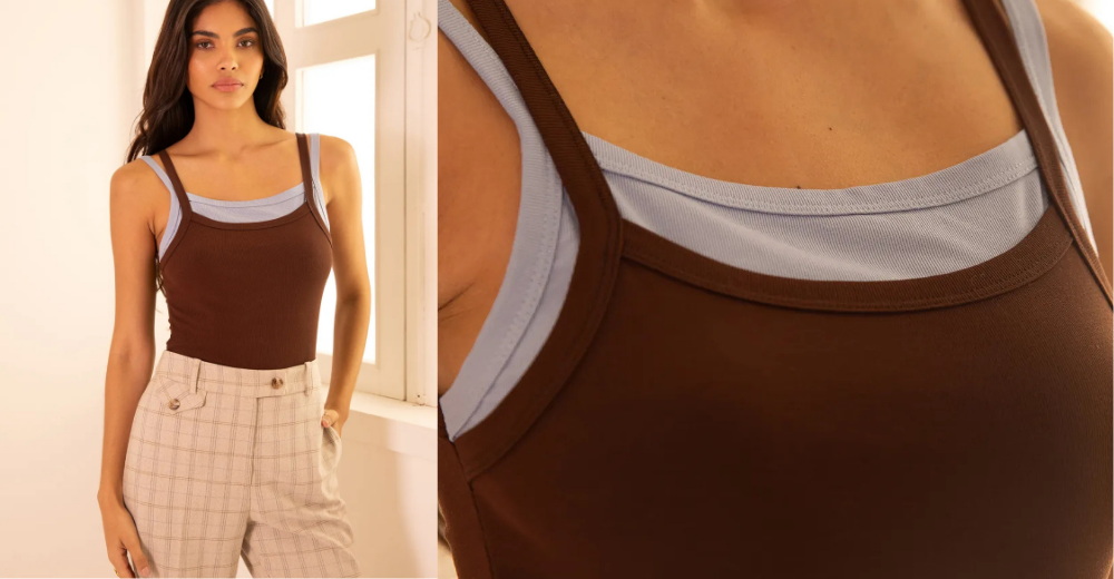 Look sport chic com top marrom e alças largas combinados com calça em tecido xadrez, claro e sofisticado